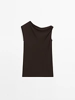 Top asymétrique avec nœud