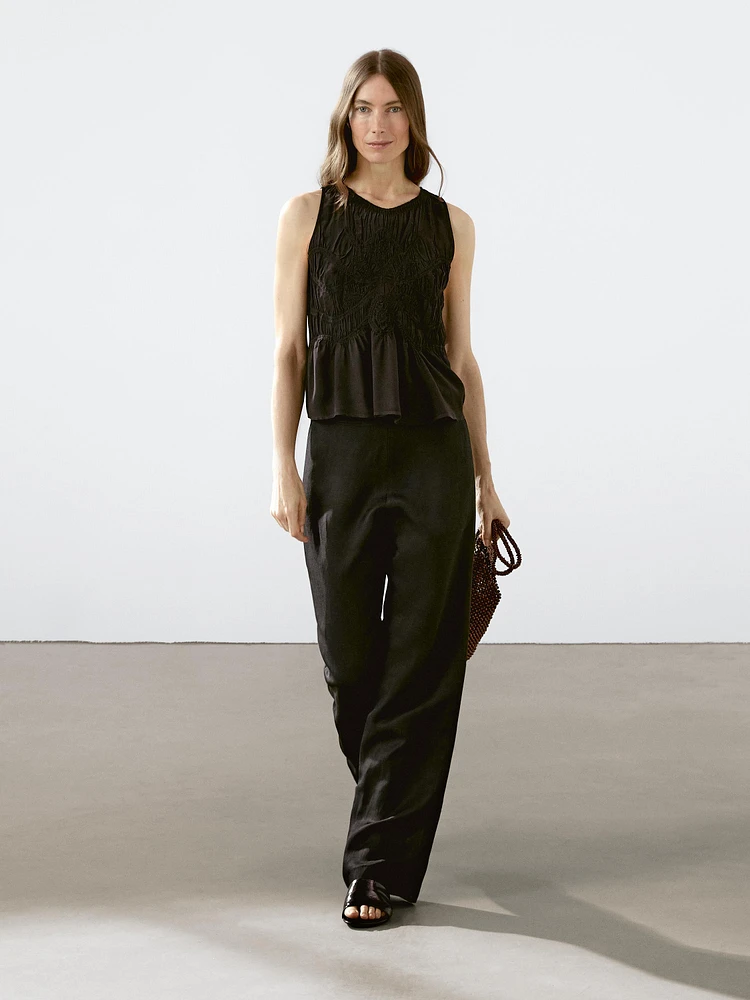 Flowing halter top with gathered detail