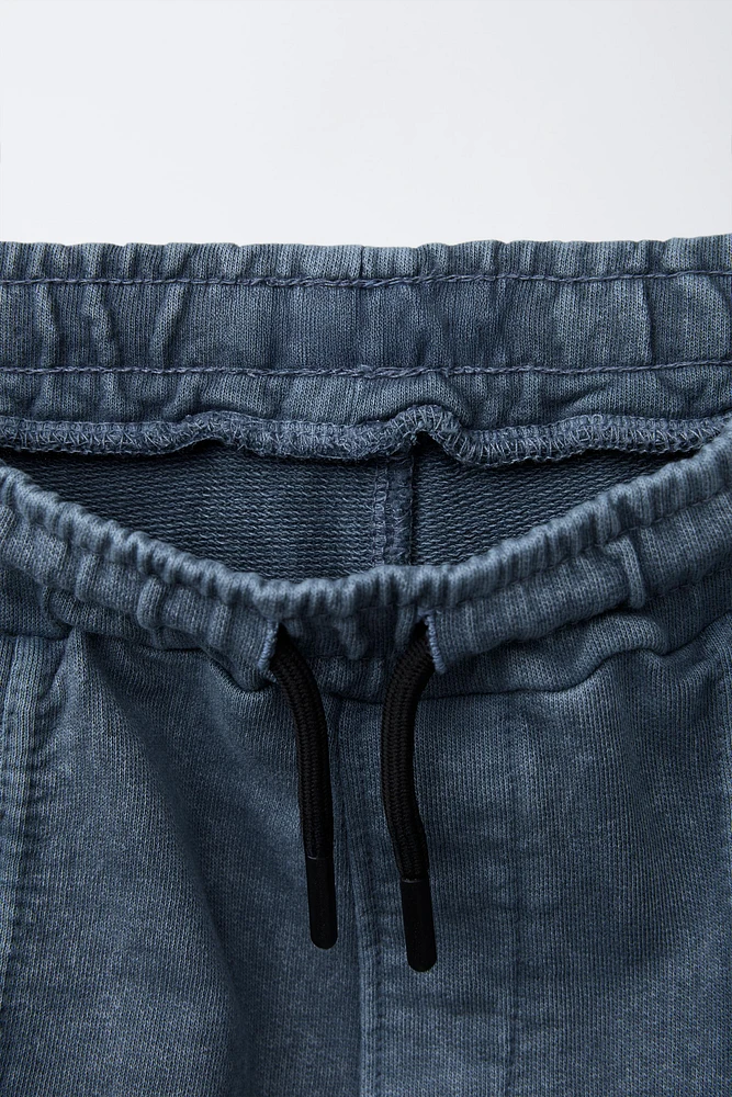 WASHED EFFECT ZIP POCKET SHORTS
