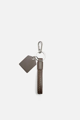 PORTE-CLÉS À SURPIQÛRES