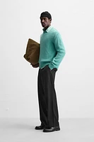 Relaxed fit cotton blend sweater. Round neck and long sleeves. Rib trim.