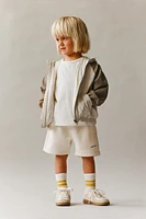 LIGHTWEIGHT HOODED RAINCOAT