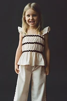 TOP WITH CONTRASTING SCALLOPED TRIM