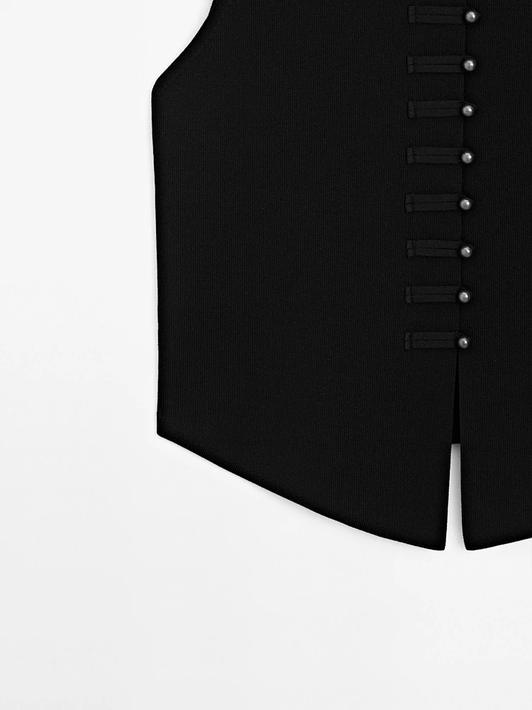Veste sans manches en maille boutons fantaisie