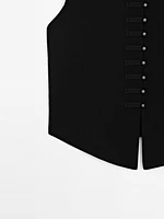 Veste sans manches en maille boutons fantaisie