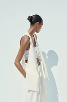 LONG VEST WITH VENTS AND MULTI-POSITION BELT