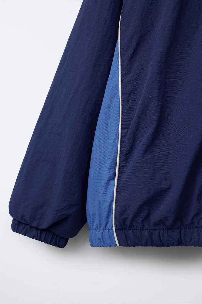 WATER REPELLENT TEXT PRINT HOODED RAINCOAT