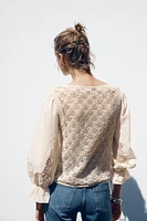POINTELLE KNIT SWEATER WITH CONTRASTING SLEEVES