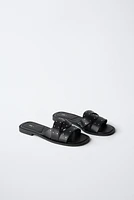 STUDDED CROSSOVER FLAT SANDALS