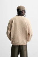 HEATHERED RIPPED EFFECT SWEATER