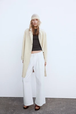 MANTEAU EN MATIÈRE SYNTHÉTIQUE