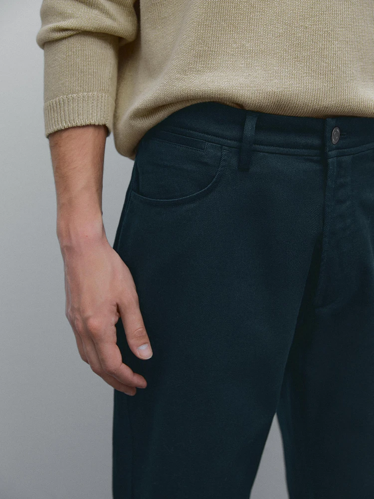 Faux jean tapered fit en coton mélangé