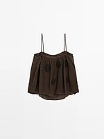 Flowing textured top with embroidered detail
