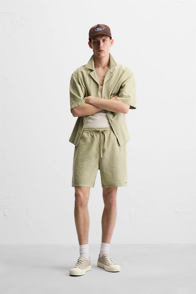 TEXTURED EMBROIDERED SHORTS