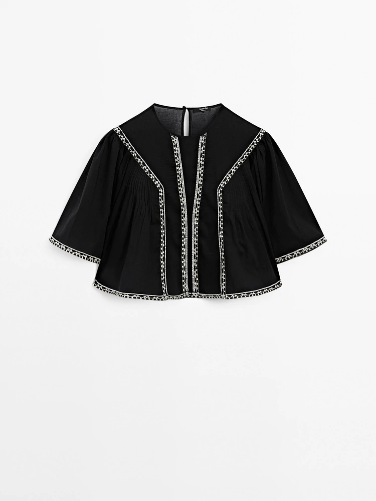 Flowing blouse with embroidered details
