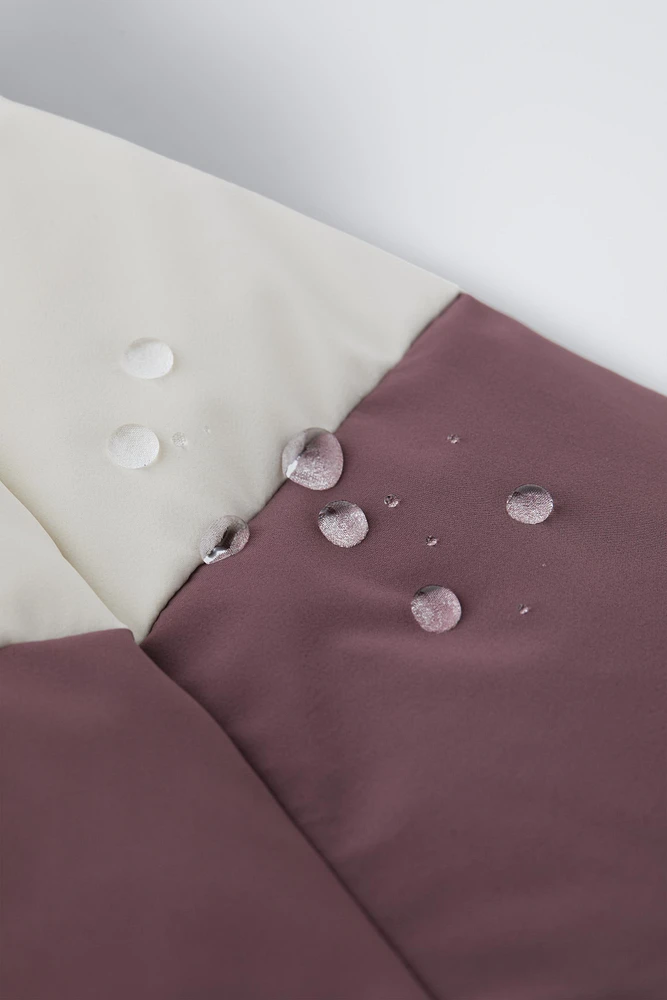 COMBINAISON DE SKI EN PLUMES COUPE-VENT ET DÉPERLANTE RECCO® SYSTEM