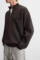 QUARTER ZIP SWEATER