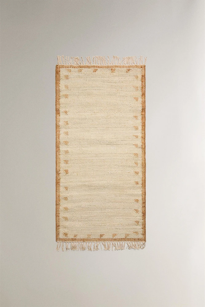 JUTE AND COTTON AREA RUG WITH FRINGING