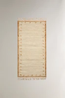 JUTE AND COTTON AREA RUG WITH FRINGING