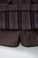 JUPE-SHORT À CARREAUX AVEC BOUCLES