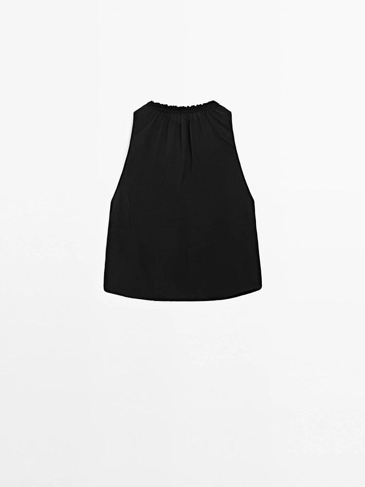 Flowing halter top with gathered detail