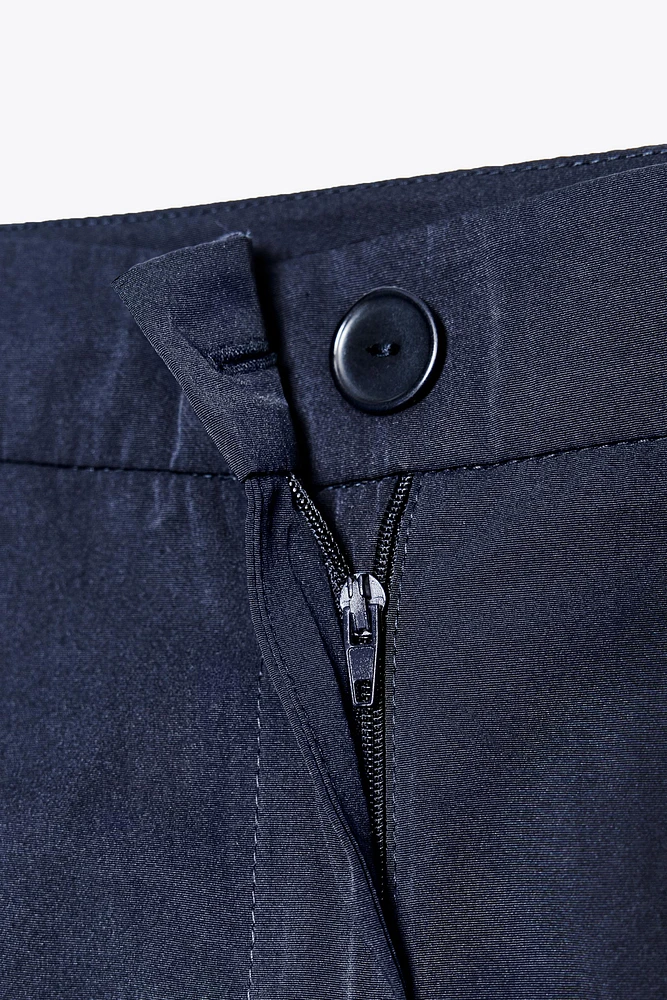LONG PLEATED SHORTS