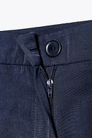 LONG PLEATED SHORTS
