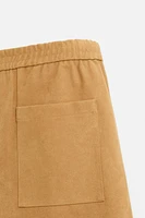 PLEATED FAUX SUEDE SHORTS