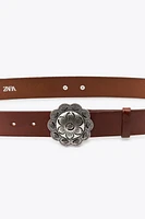 CEINTURE EN CUIR À FLEUR MÉTALLIQUE