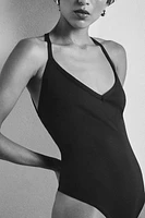 PLAIN BEACH SWIMSUIT WITH STRAPS AT THE BACK