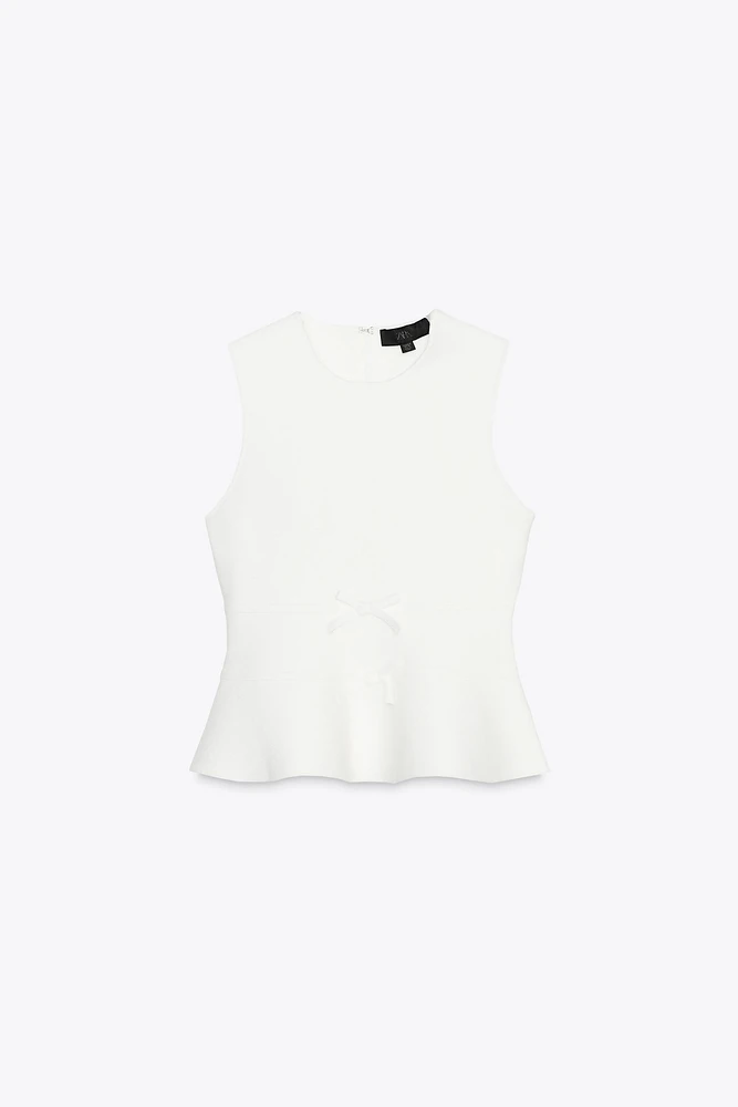 TOP EN MAILLE PÉPLUM AVEC LACETS