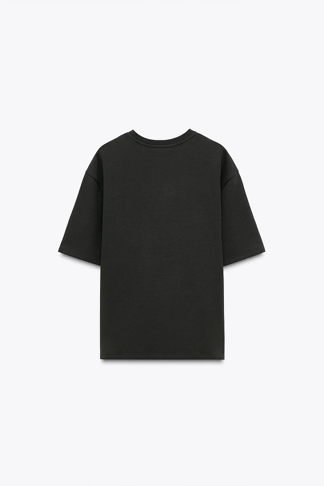 SWEAT EN MAILLE SURJET À MANCHES COURTES