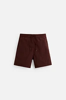 DRAWSTRING SWIM TRUNKS