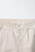 PANTALON BAGGY À BOUTONS EN LIN