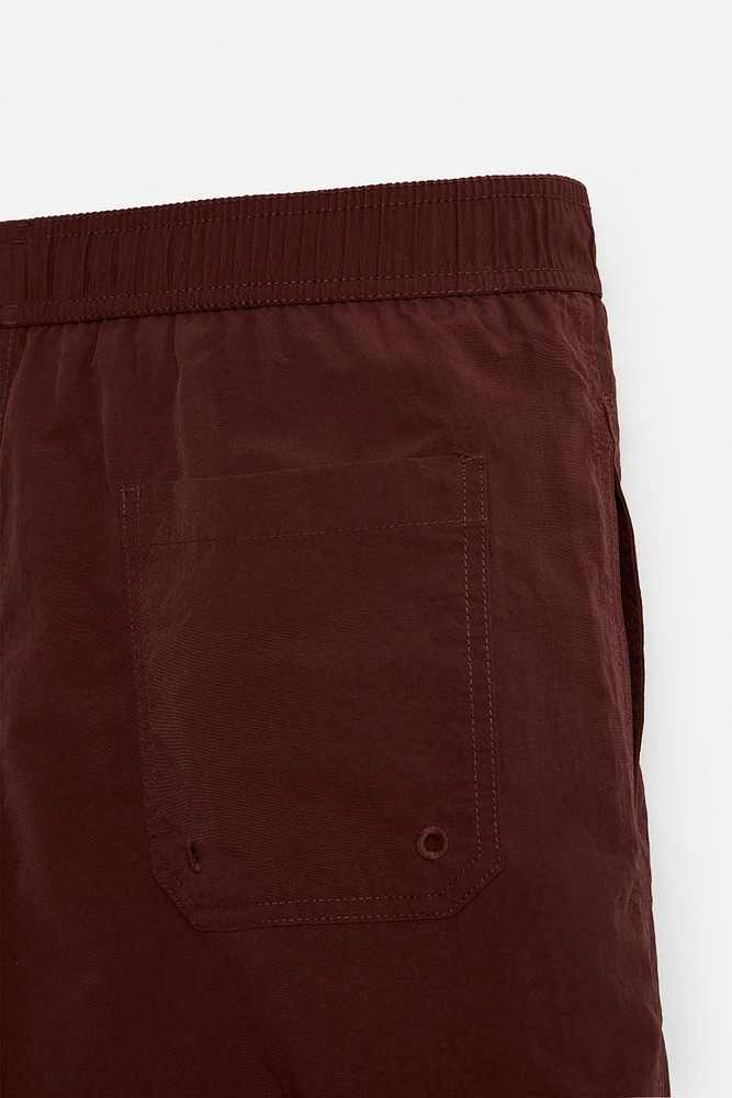 DRAWSTRING SWIM TRUNKS