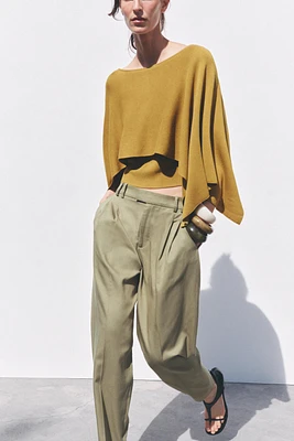 TOP EN MAILLE TYPE CAPE