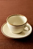 PORCELAIN TEACUP WITH ANTIQUE FINISH RIM