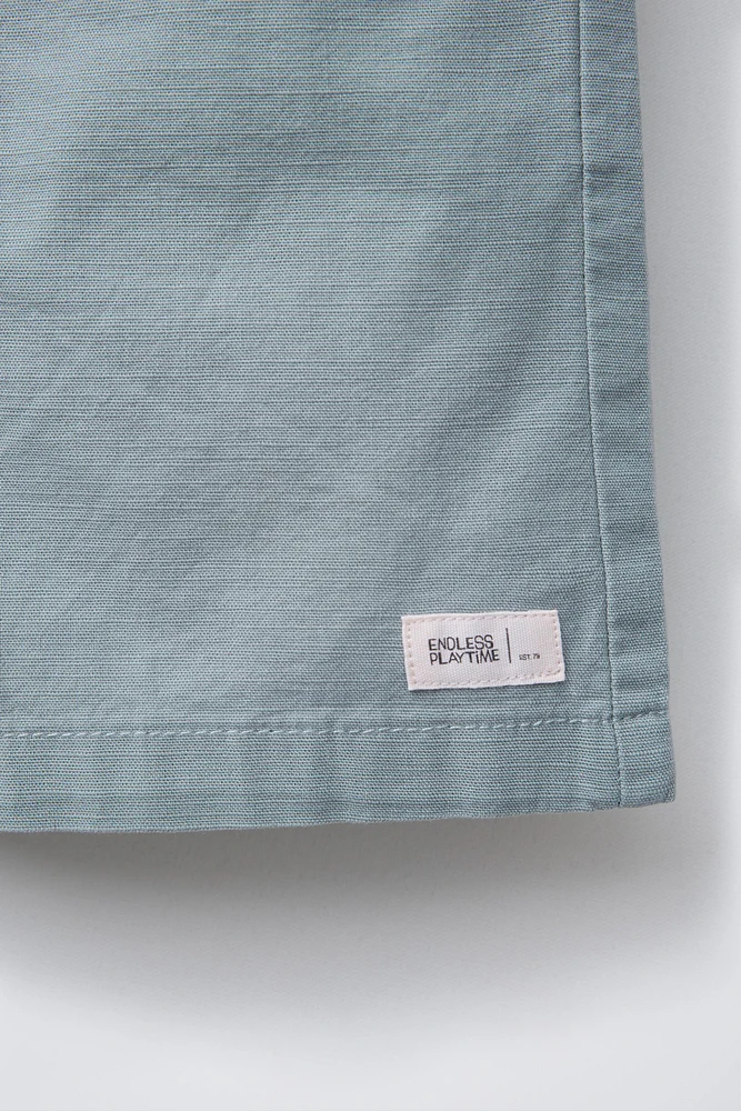 BERMUDA EN COTON COUPE AMPLE ÉTIQUETTE