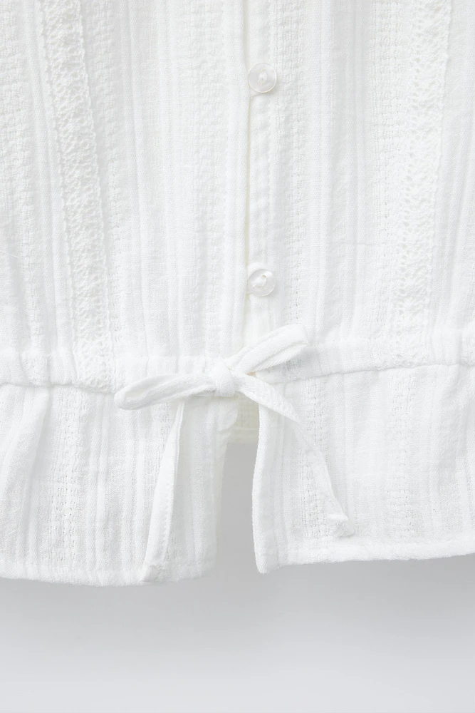 TEXTURED TIED BLOUSE