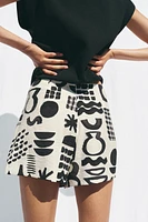 PRINTED BUCKLE MINI SKIRT