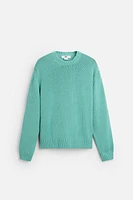 Relaxed fit cotton blend sweater. Round neck and long sleeves. Rib trim.