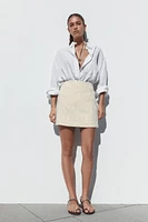 MINI SKIRT WITH FRAYED EMBROIDERY