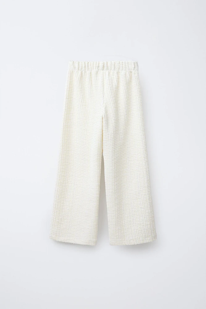 TEXTURED PANTS WITH JEWEL BUTTONS