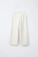TEXTURED PANTS WITH JEWEL BUTTONS