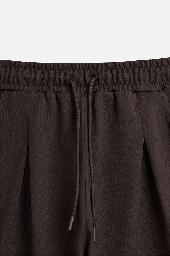 PLEATED OVERSIZED FIT BERMUDA SHORTS