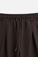 PLEATED OVERSIZED FIT BERMUDA SHORTS
