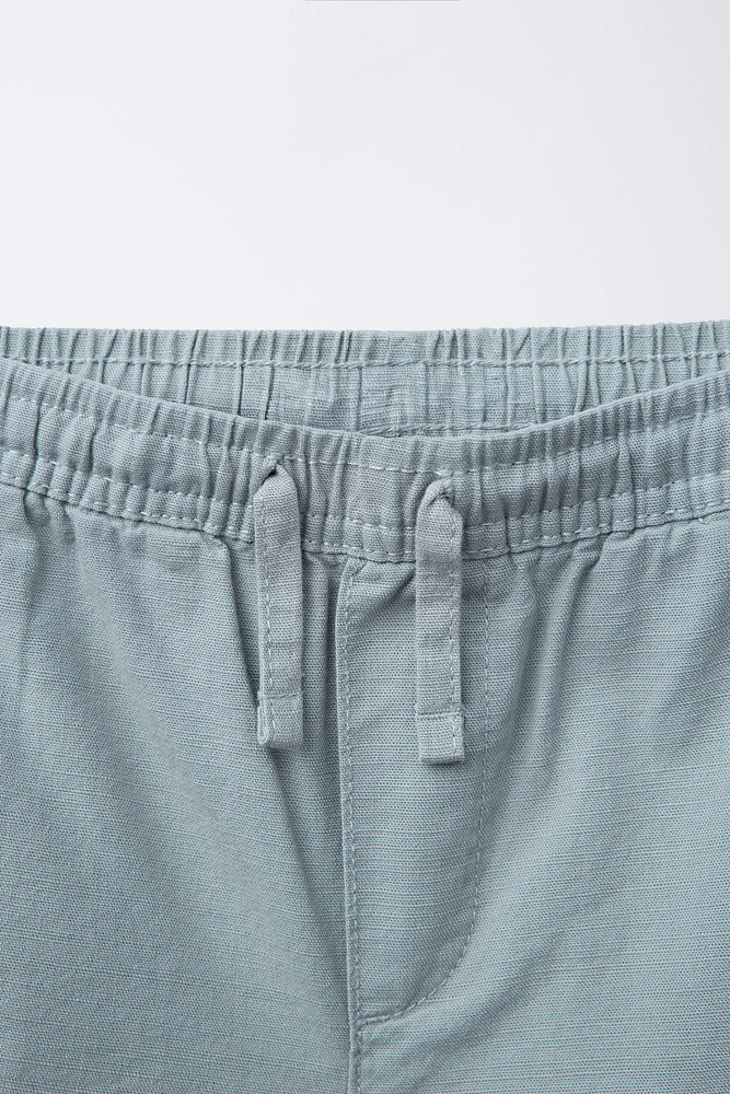 BERMUDA EN COTON COUPE AMPLE ÉTIQUETTE