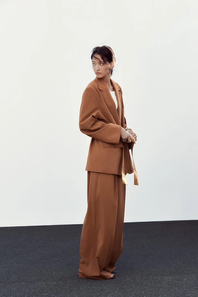 VESTE OVERSIZE À CEINTURE