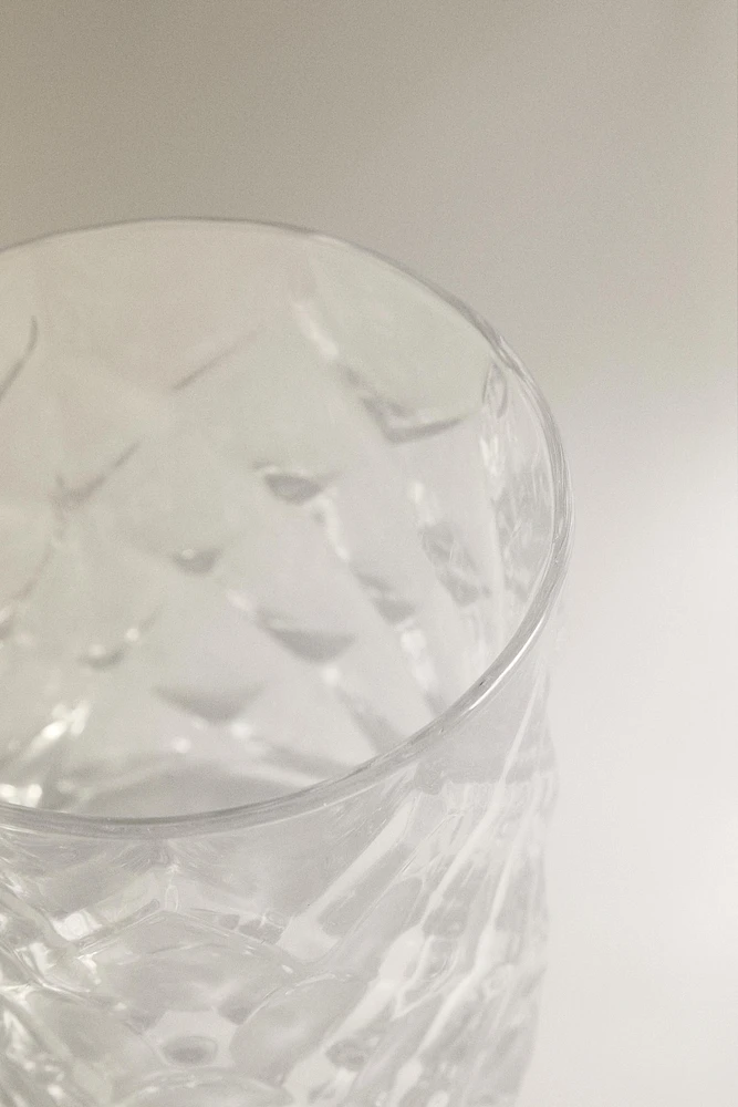 CRYSTALLINE TUMBLER WITH RAISED DESIGN