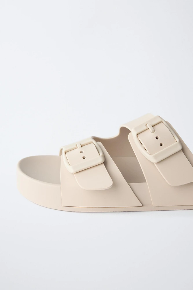 BUCKLED POOL SLIDES